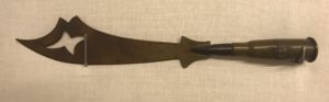 A small sword shaped piece of trench art