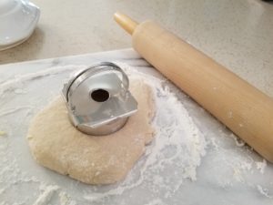Dough beign rolled and cut