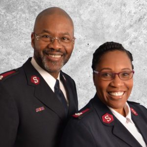 Graphic button showing a photo of Majors K. Kendall & Katrina Mathews