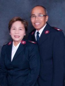 Photograph of the Majors Bruce and Betty Keobounhom wearing Salvation Army uniforms