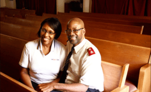 Photograph of Majors K. Kendall and Katrina Mathews seated in a chapel