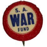 Small round pin with white center and red outer rim. Text in center in blue reads "S.A. War Fund."