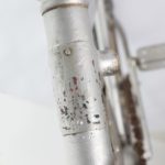 Photograph of the head tube and badge of a bicycle.