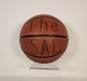 A basketball with "The Sal" written in black marker