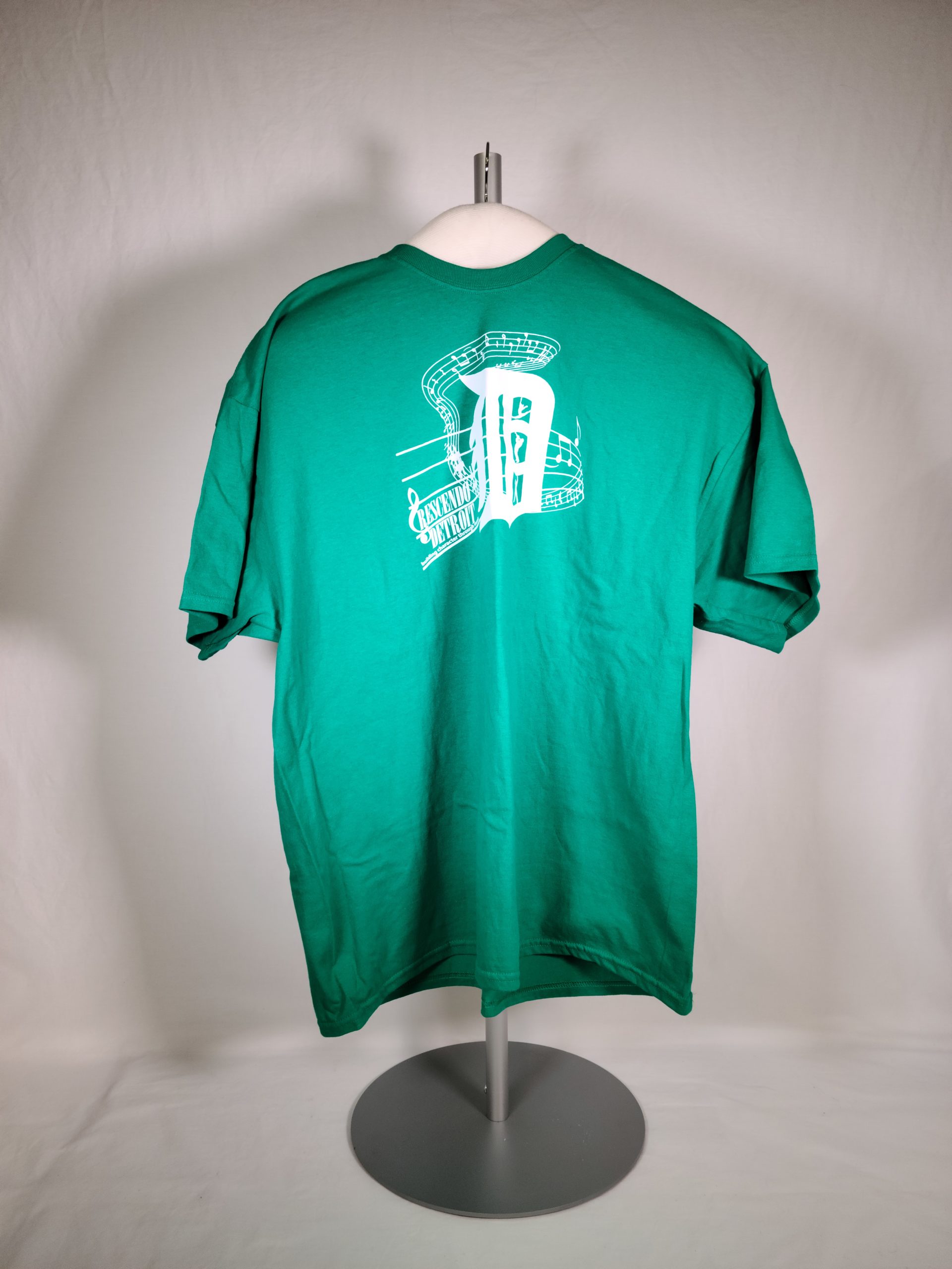 A green t-shirt with white logo for "Crescendo Detroit"