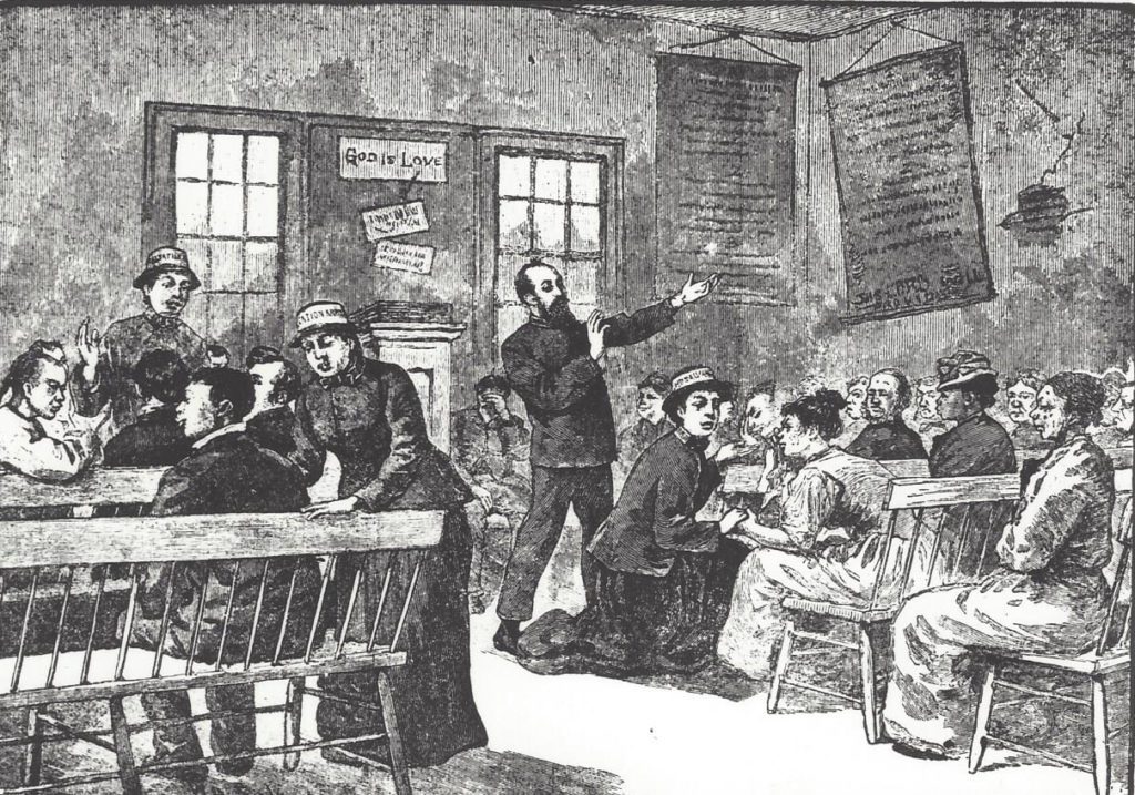 Antique engraving depicting the first Salvation Army meeting in New York in 1880. One male and several female Salvation Army officers can be seen preaching to and interacting with the audience, which is composed of Asian Americans, African Americans, and White parissioners.