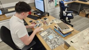 Emmet Burke sorting photographs.