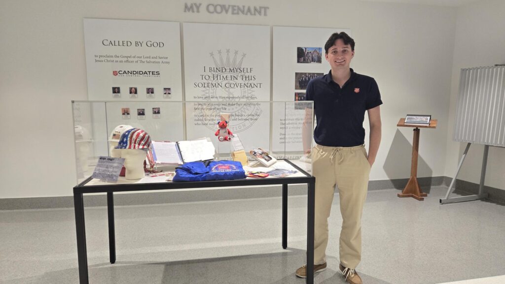 Emmet Burke standing next to the 9/11 display.